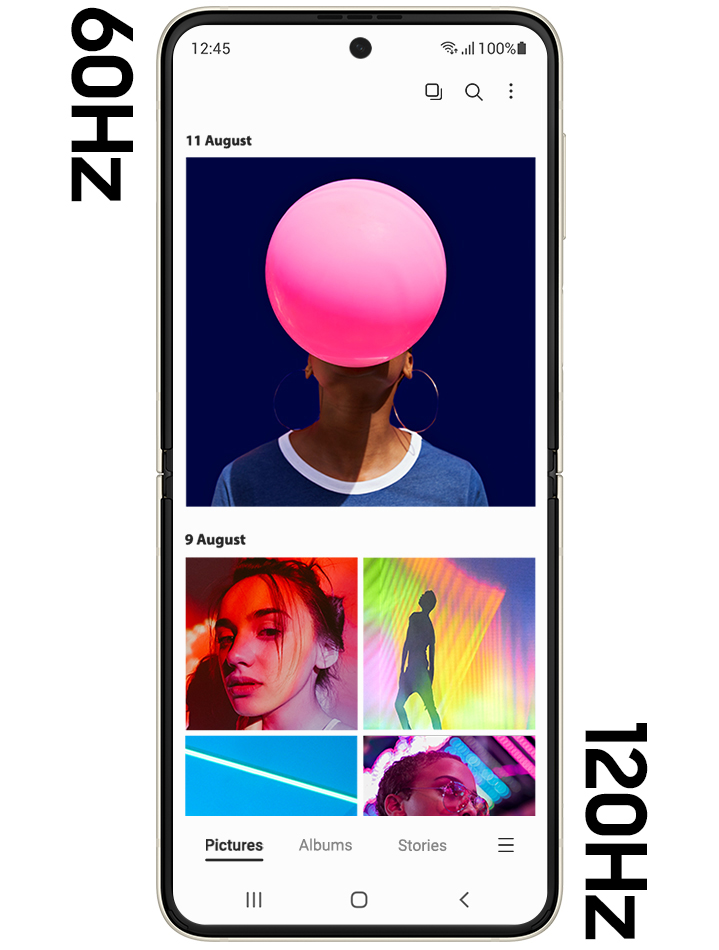 Galaxy Z Flip3 5G unfolded, showing the Gallery app onscreen, with several brightly colored photos onscreen. The screen is slightly blurry, demonstrating the lesser graphic quality of the 60Hz refresh rate. The screen changes to the 120Hz rate and the content onscreen is seen crisp and clear.