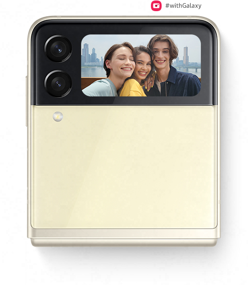 Folded Galaxy Z Flip3 5G seen from the Front Cover with a group selfie on the Cover Screen, being captured with Quick Shot.