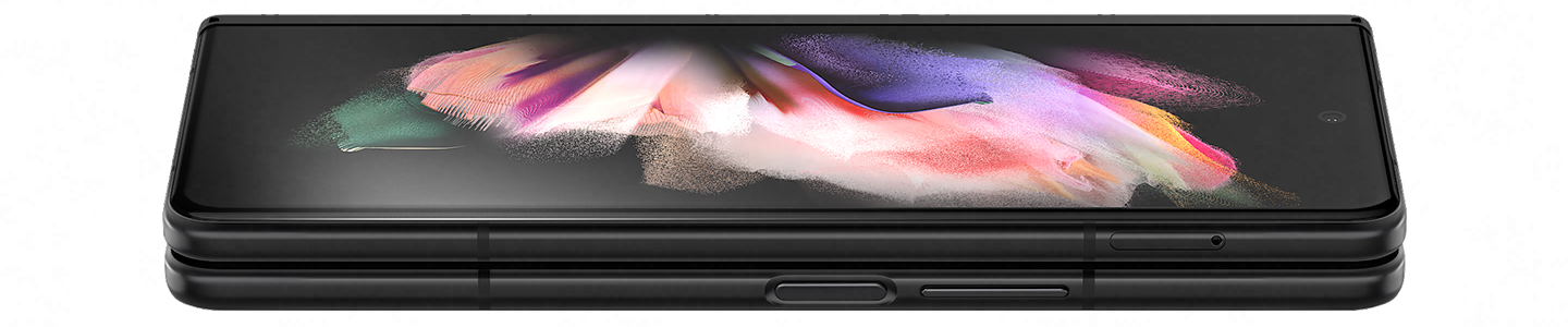 Folded Galaxy Z Fold3 5G seen from the open side. A colorful wallpaper is seen on the Cover Screen, and it turns slightly until only the edges show, to demonstrate how thin Corning® Gorilla® Glass Victus™ is.