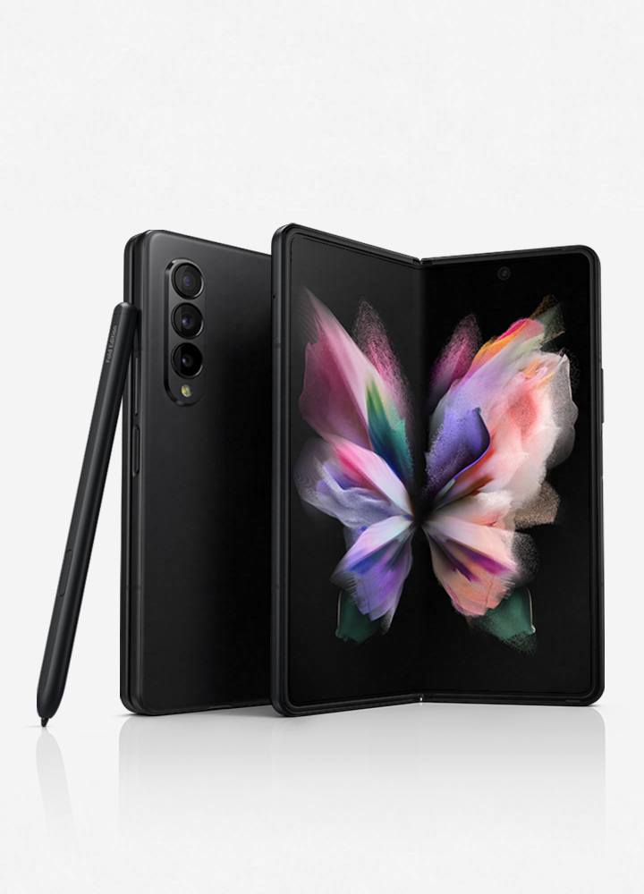 Two Galaxy Z Fold3 5G phones, one seen folded from the Back Cover and one seen unfolded with a colorful wallpaper on the Main Screen. The S Pen Fold Edition leans against the folded phone.